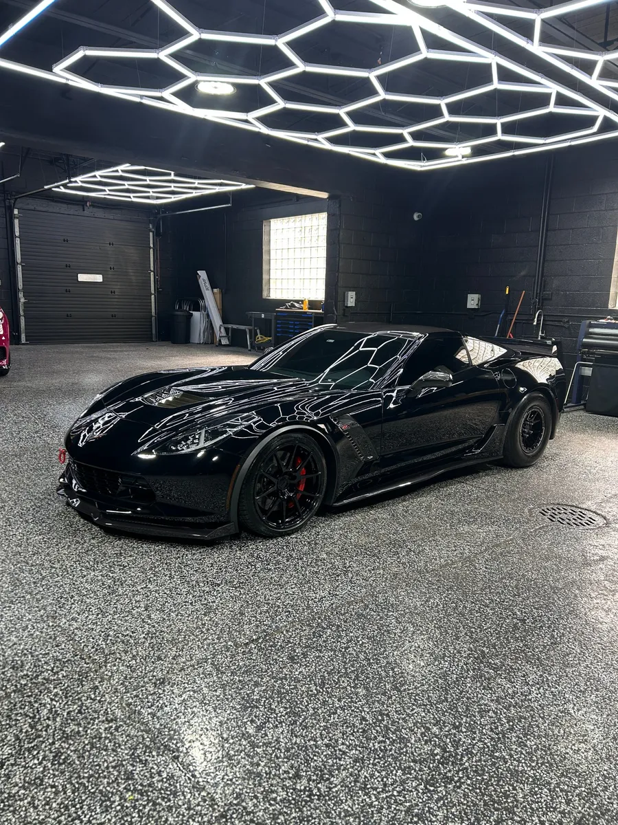 Black Chevrolet Corvette in the Elite Auto Lab shop in Madison Heights, a paint protection film job